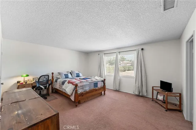 a bed room with furniture and a window