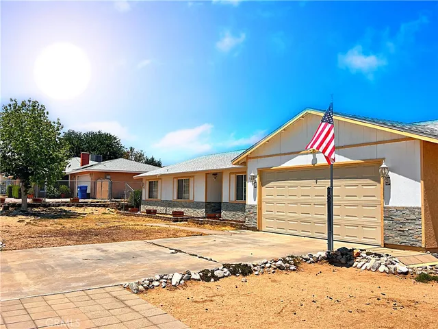 a front view of a building with a yard