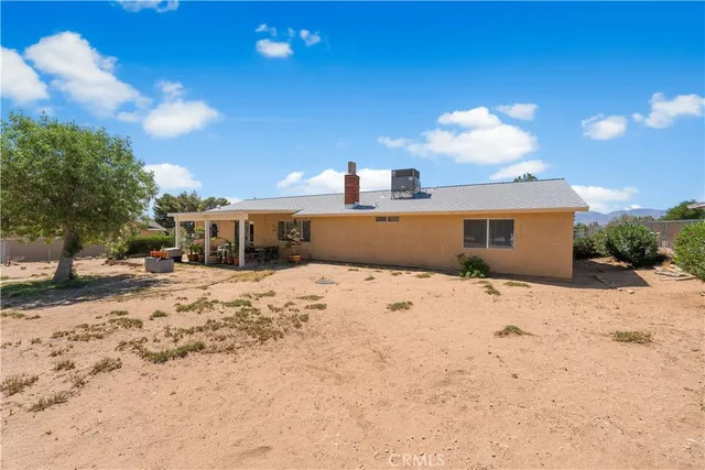 a view of a house with snow on the road