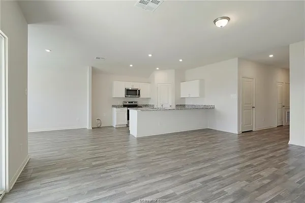 a view of kitchen with wooden floor