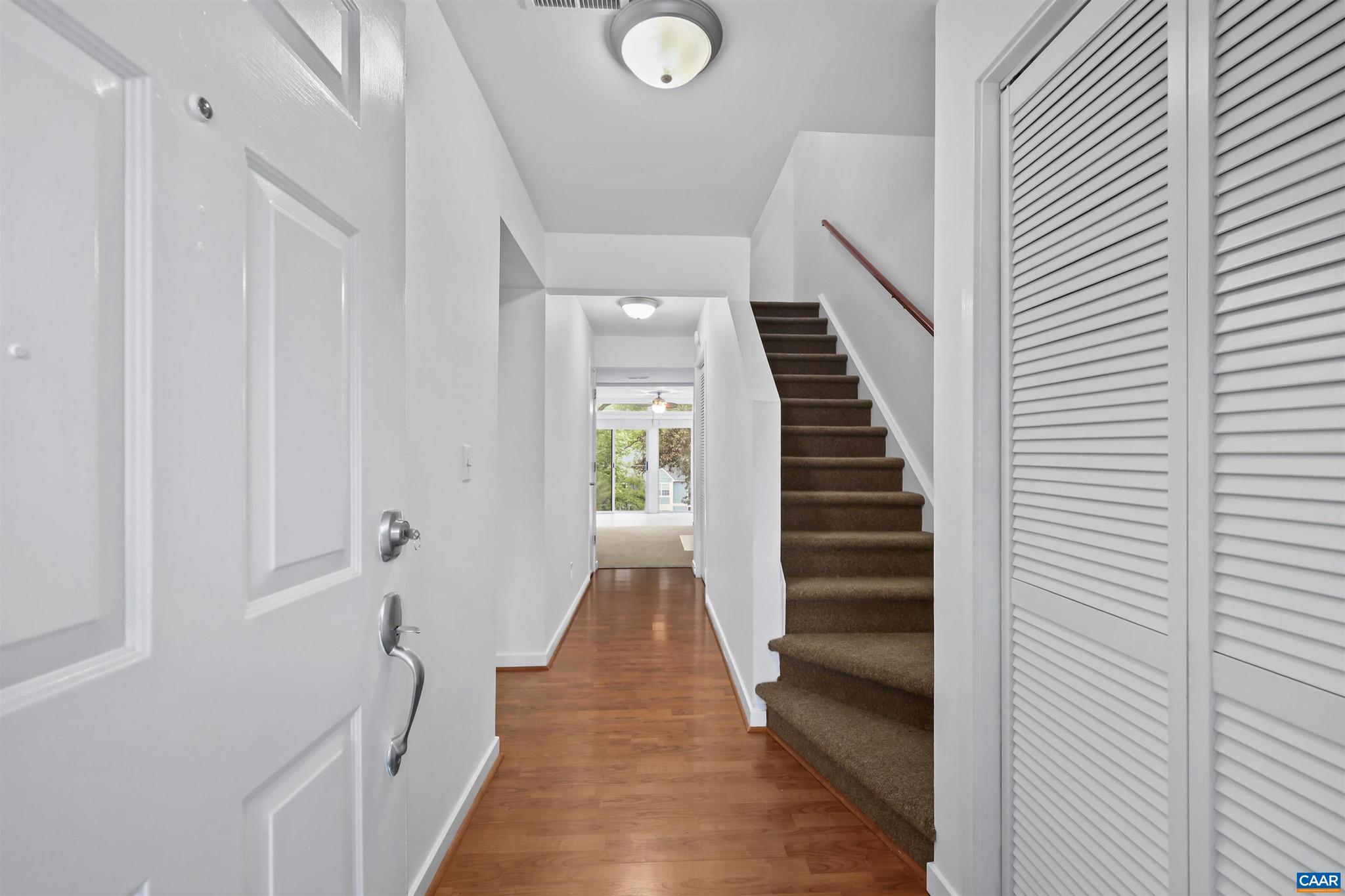 1250 Maple View Drive Charlottesville, VA 22902 - Photo 3 of 25 a view of a hallway with wooden floor and entryway