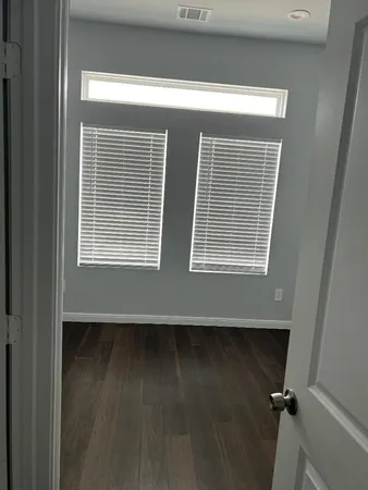 a view of a room that has a window in it