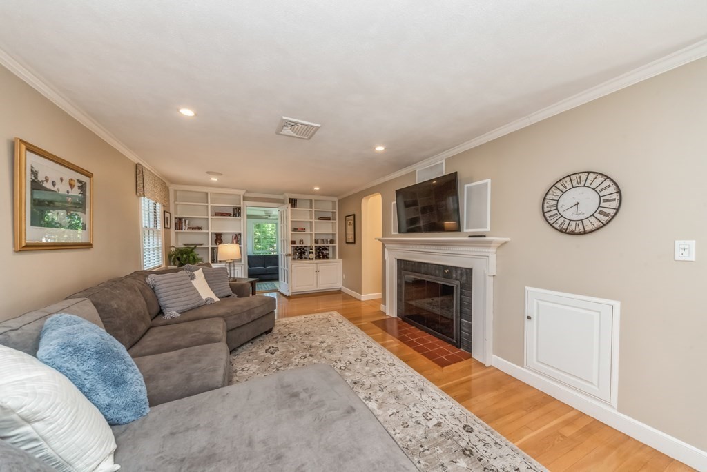 110 Parker Road Needham, MA 02494 - Photo 3 of 33 a living room with furniture a fireplace and a window