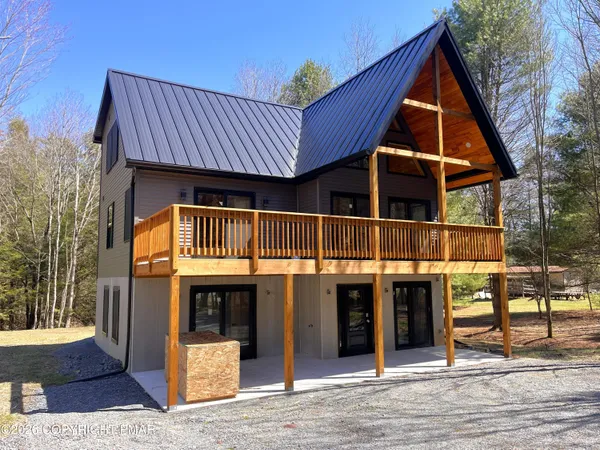 a view of a house with wooden stairs