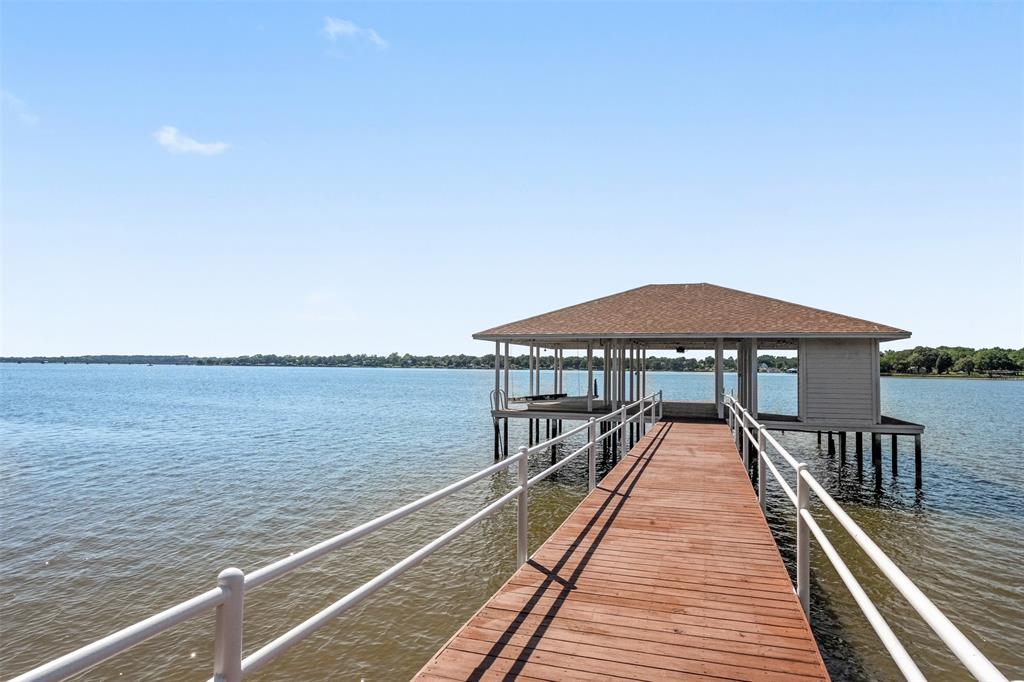14354 Ridge Lane Malakoff, TX 75148 - Photo 35 of 40 a wooden deck with sunset view