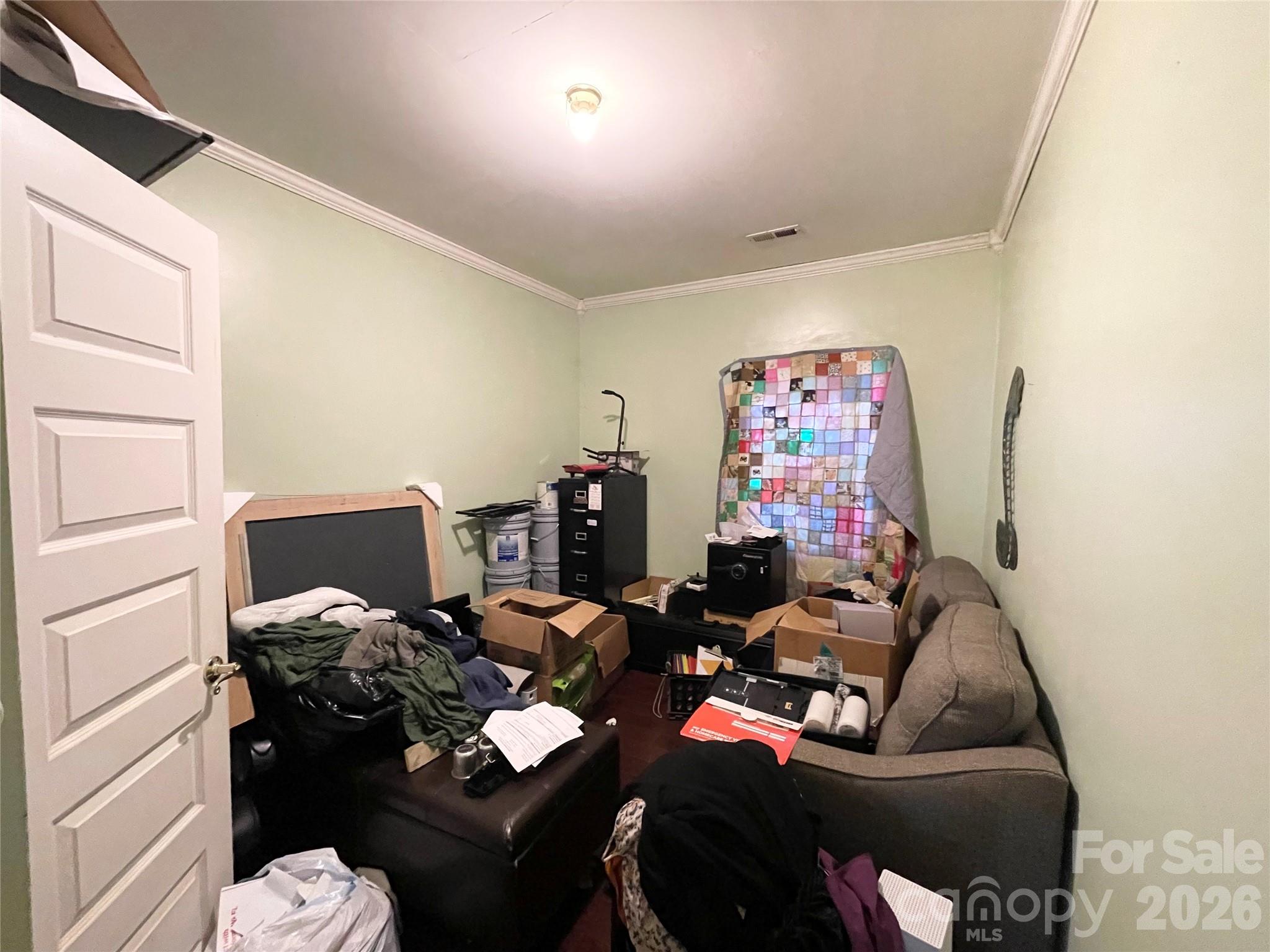 2831 Bettis Road Grover, NC 28073 - Photo 20 of 34 a living room with furniture flowerpot and a flat screen tv