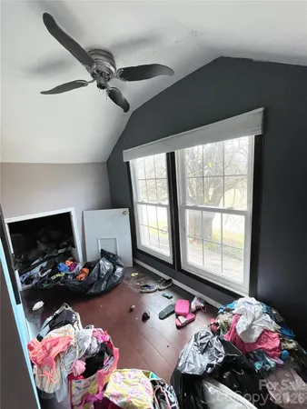 a room with furniture and musical instruments