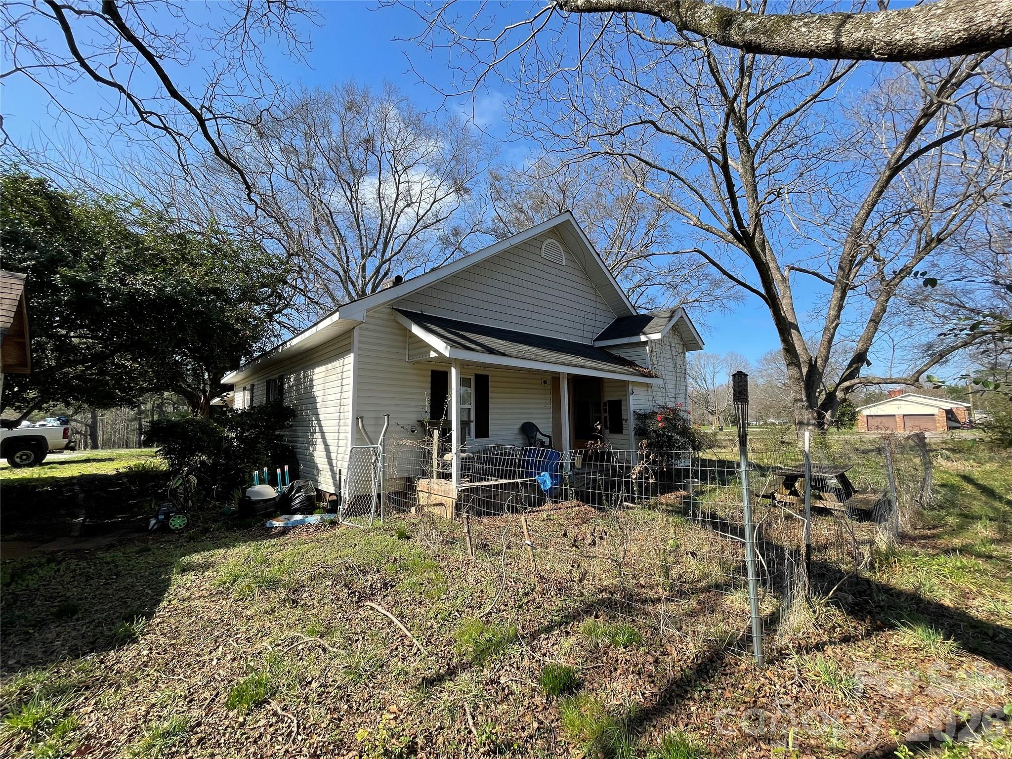 2831 Bettis Road Grover, NC 28073 - Photo 29 of 34 a view of a house with a yard patio and sitting area