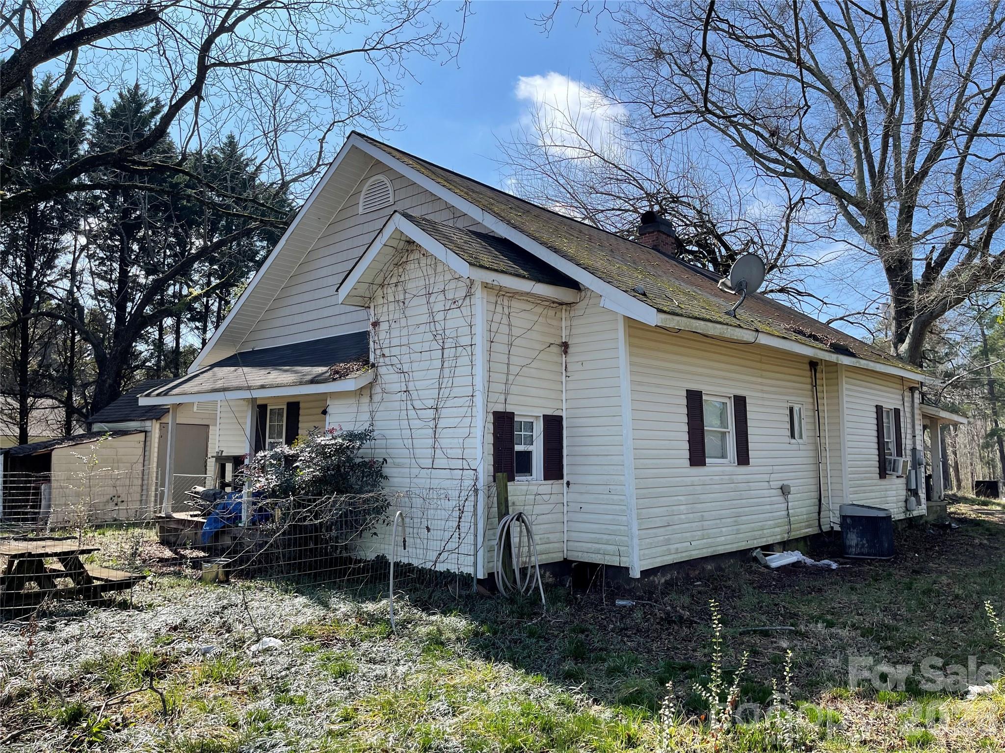 2831 Bettis Road Grover, NC 28073 - Photo 32 of 34 a view of a house with a yard and furniture