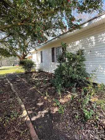 a view of backyard with outdoor space