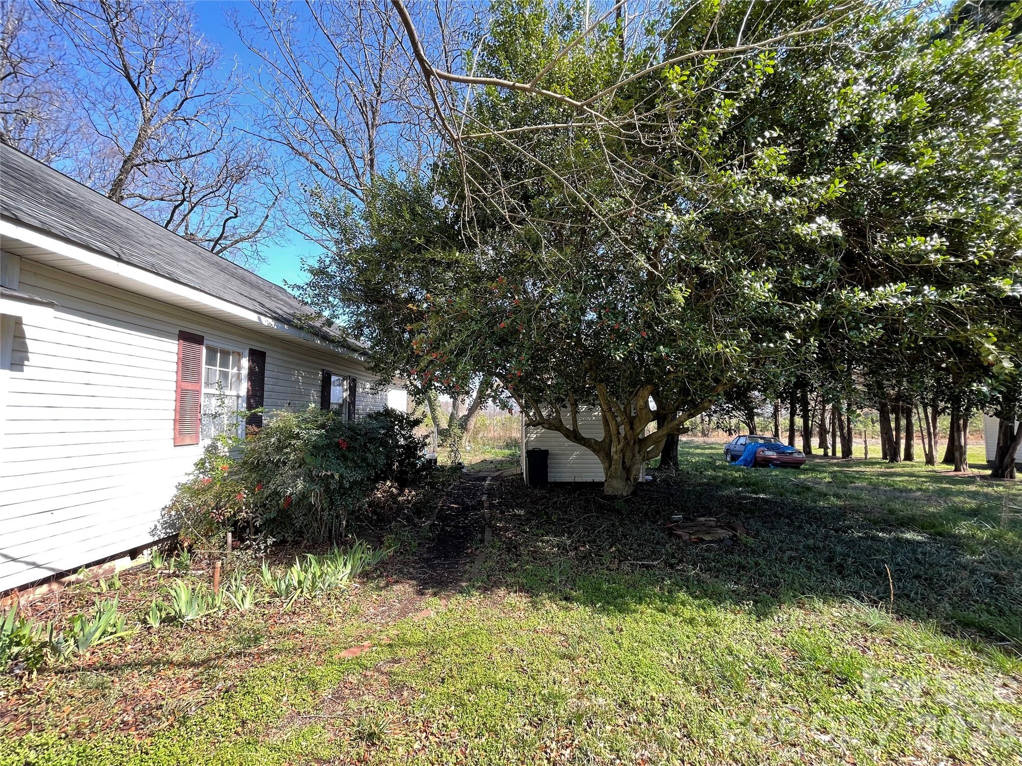 2831 Bettis Road Grover, NC 28073 - Photo 6 of 34 a view of a yard with plants and trees