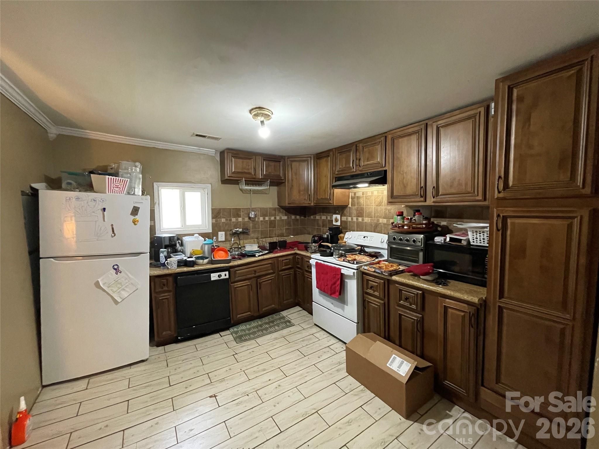 2831 Bettis Road Grover, NC 28073 - Photo 7 of 34 a kitchen with stainless steel appliances granite countertop a refrigerator stove microwave and sink