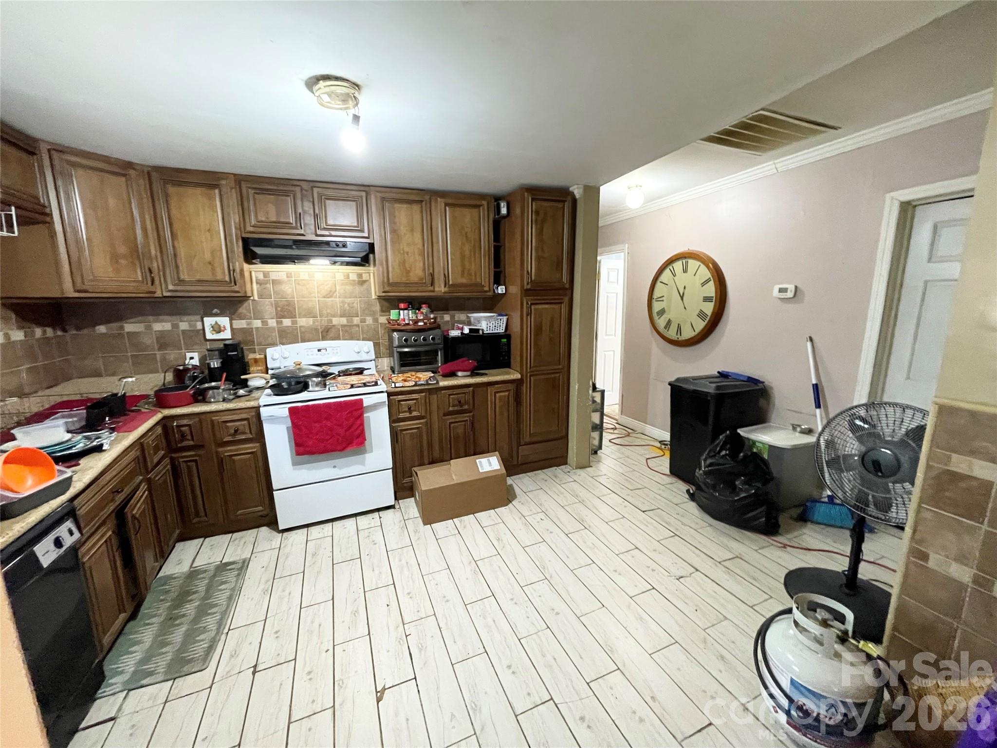 2831 Bettis Road Grover, NC 28073 - Photo 8 of 34 a kitchen with a stove a refrigerator and a sink