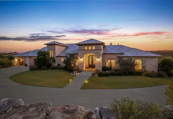 a view of a big house with a big yard