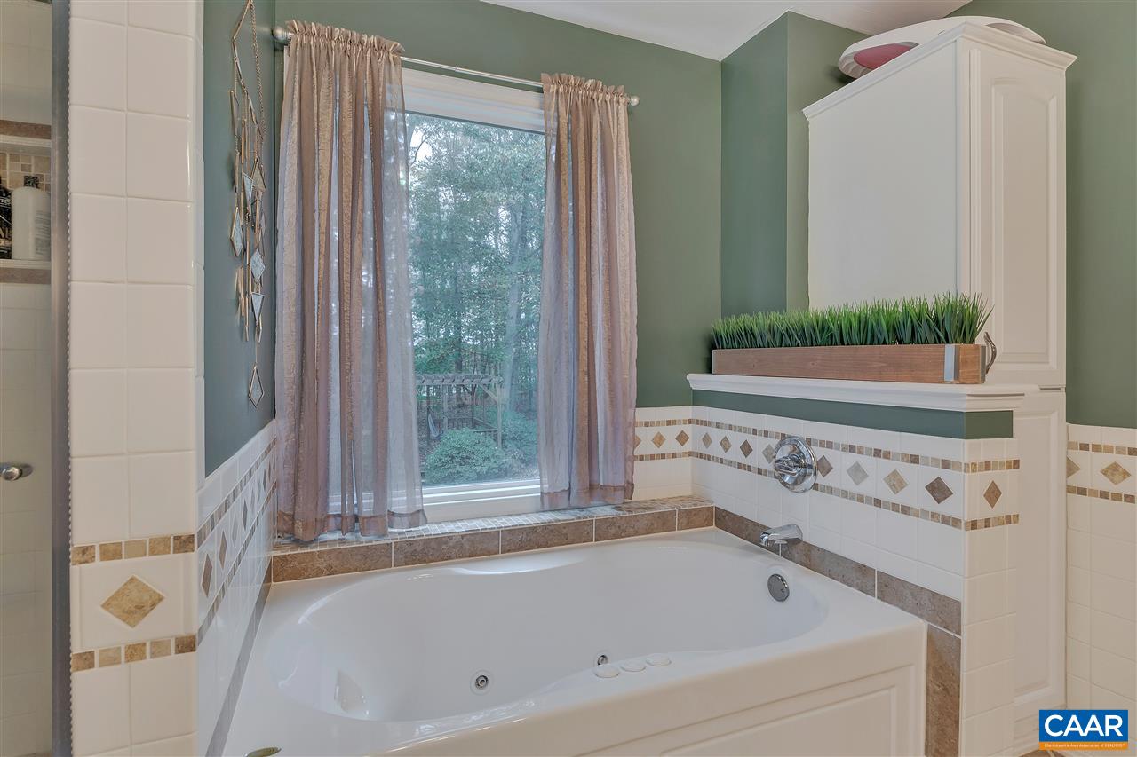 792 Fanny White Road Buckingham, VA 23921 - Photo 15 of 50 a bathroom with bathtub and window