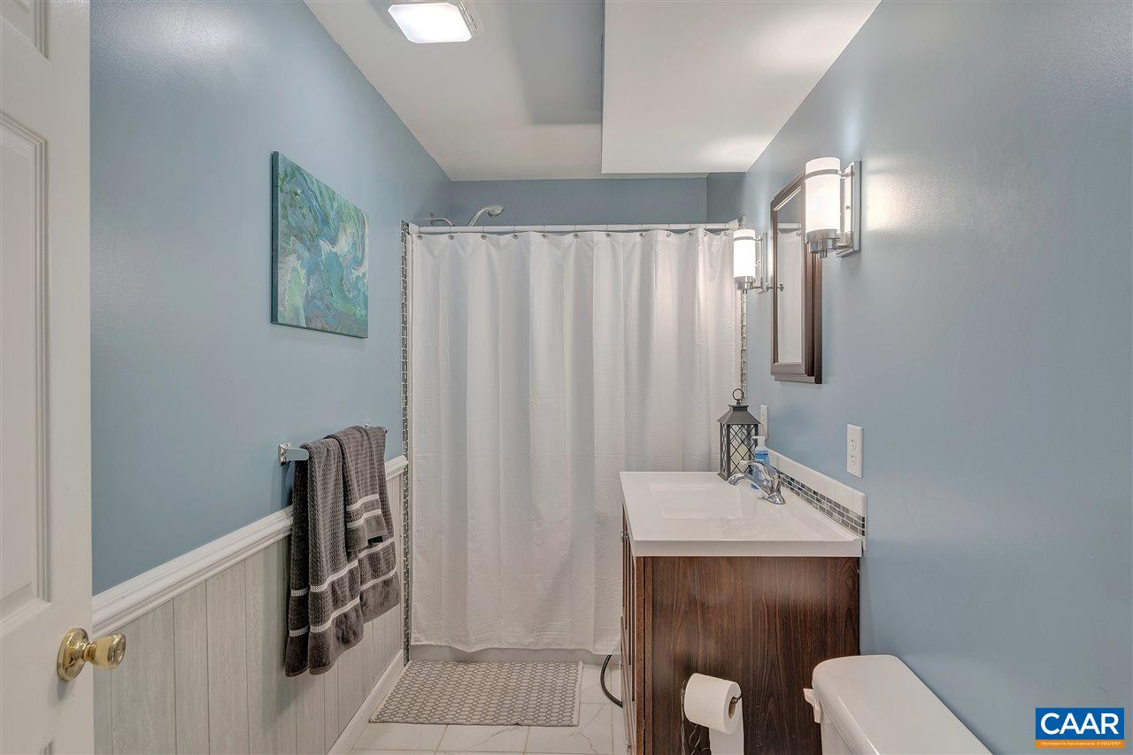 792 Fanny White Road Buckingham, VA 23921 - Photo 23 of 50 a bathroom with a toilet sink and mirror