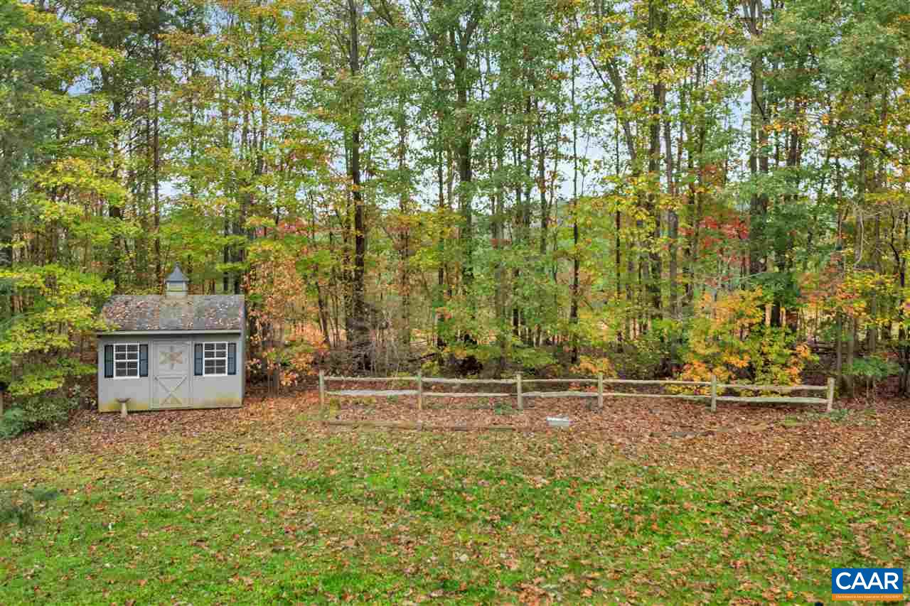 792 Fanny White Road Buckingham, VA 23921 - Photo 31 of 50 a backyard of a house with lots of green space and fountain