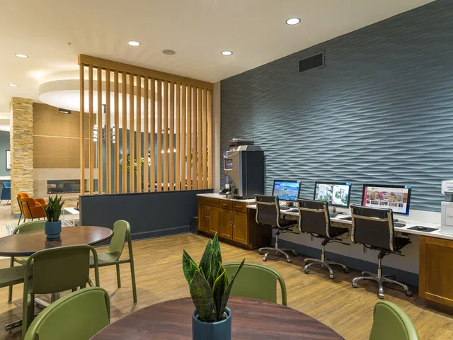 a lobby with furniture pool table table and chairs