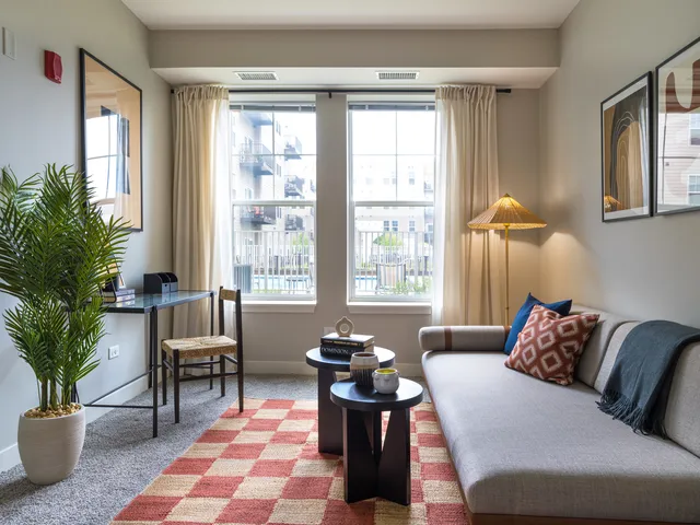 a living room with furniture and a window