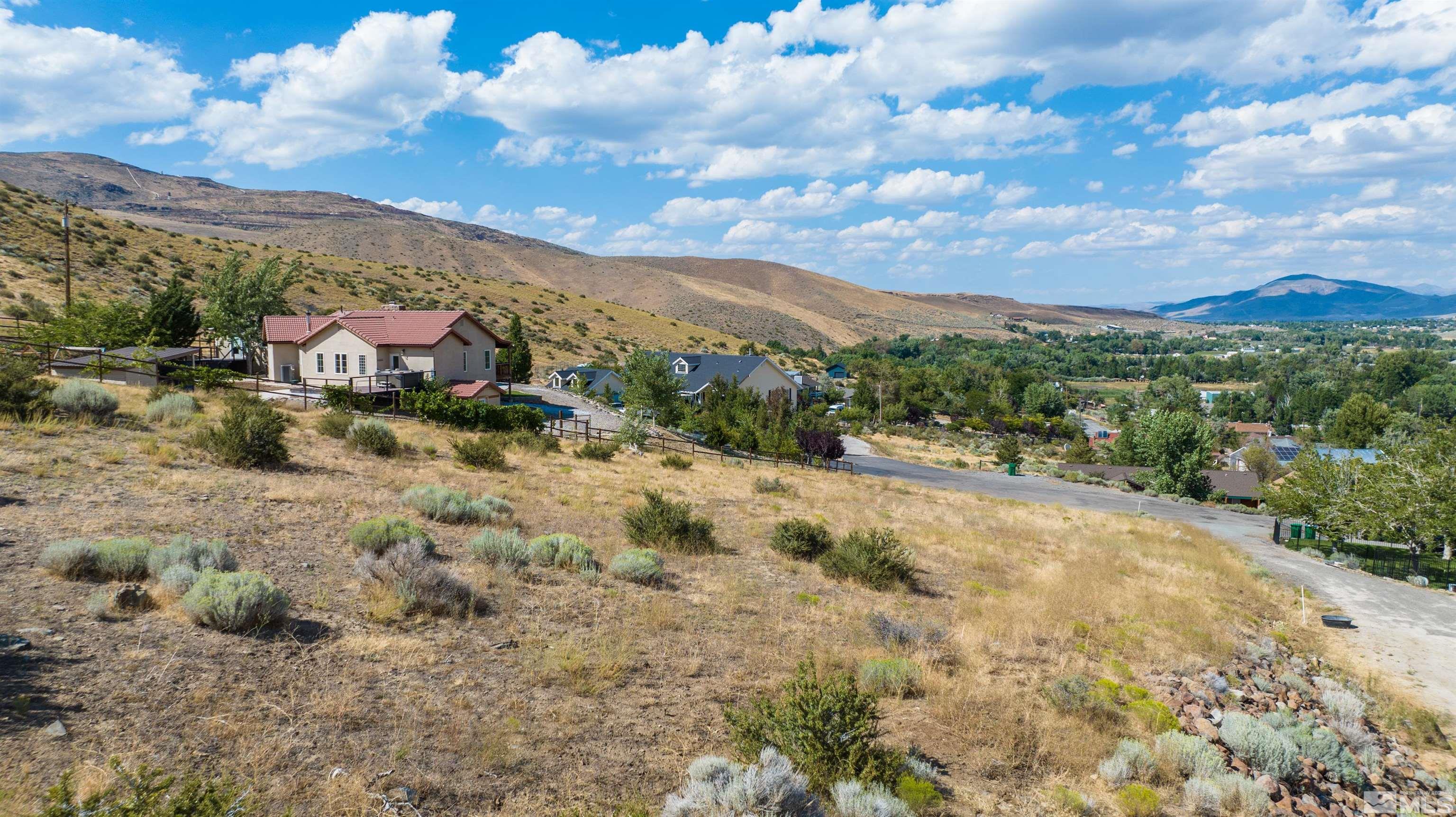 110 Del Mesa Circle Reno, NV 89521 - Photo 30 of 33 a view of a lake with mountains in the background