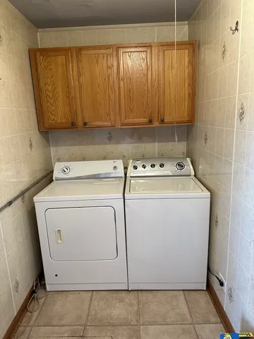 a utility room with dryer and washer