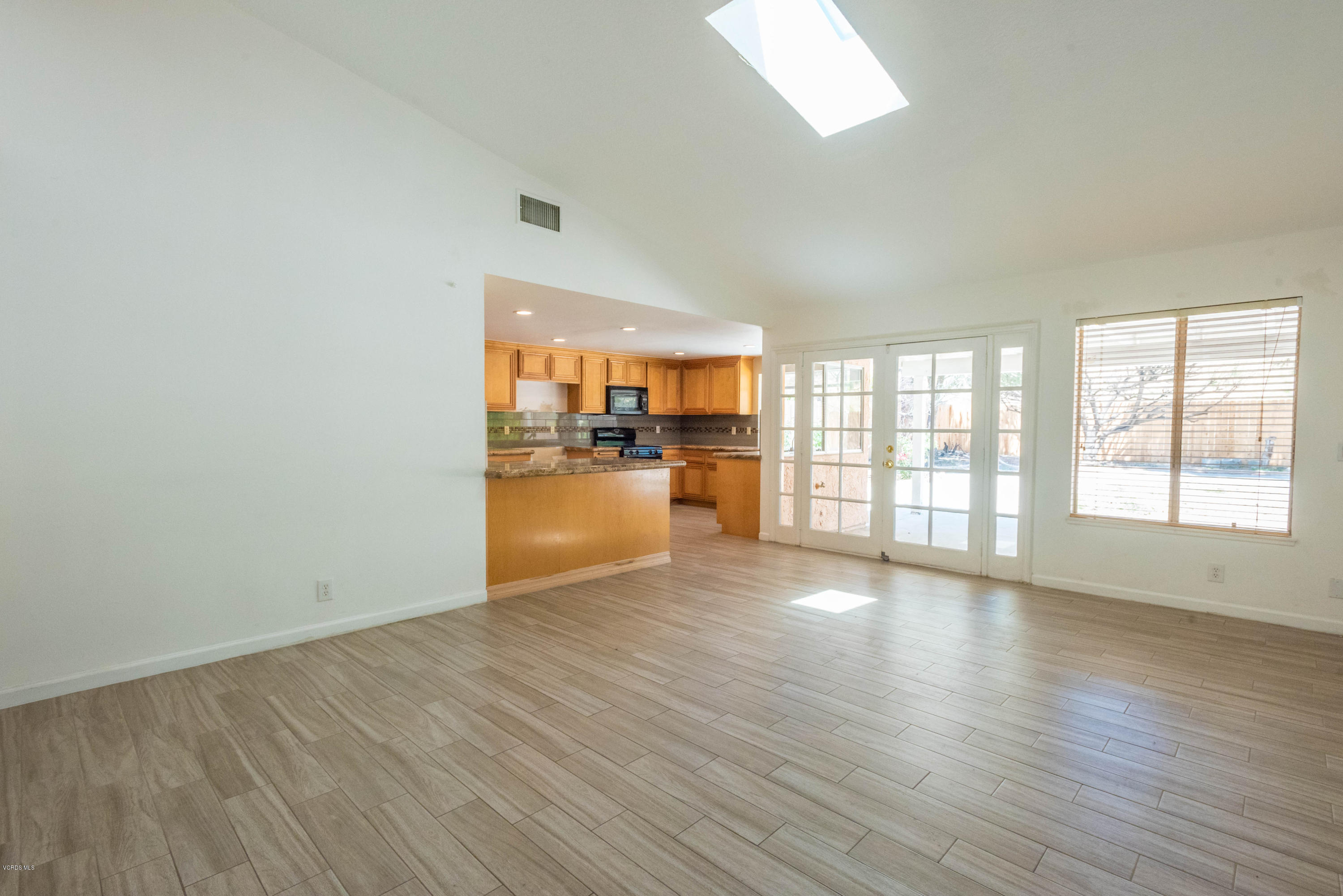26026 Redbluff Drive Calabasas, CA 91302 - Photo 11 of 23 wooden floor in an empty room with a window