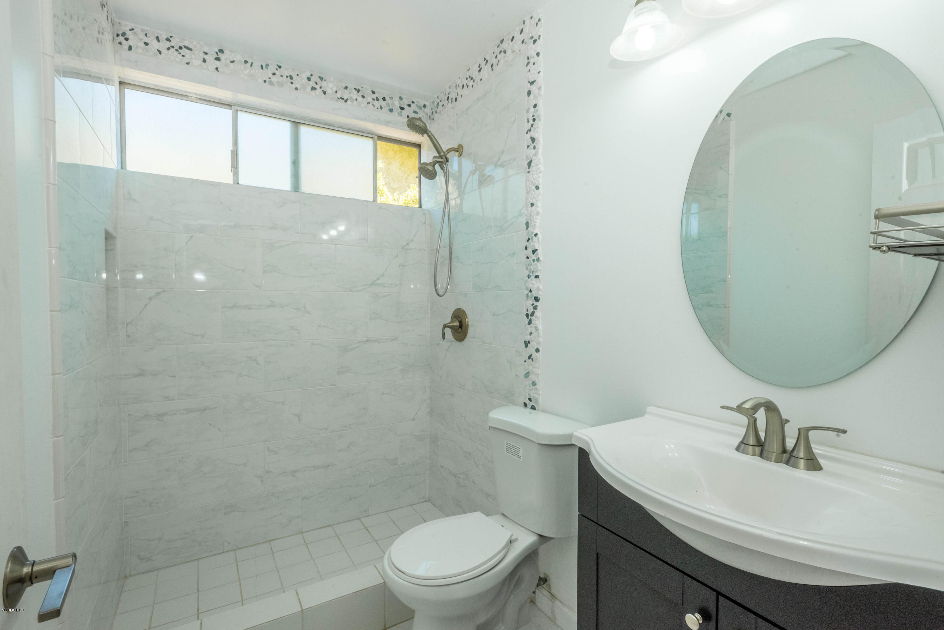 26026 Redbluff Drive Calabasas, CA 91302 - Photo 12 of 23 a bathroom with a sink a toilet and a mirror