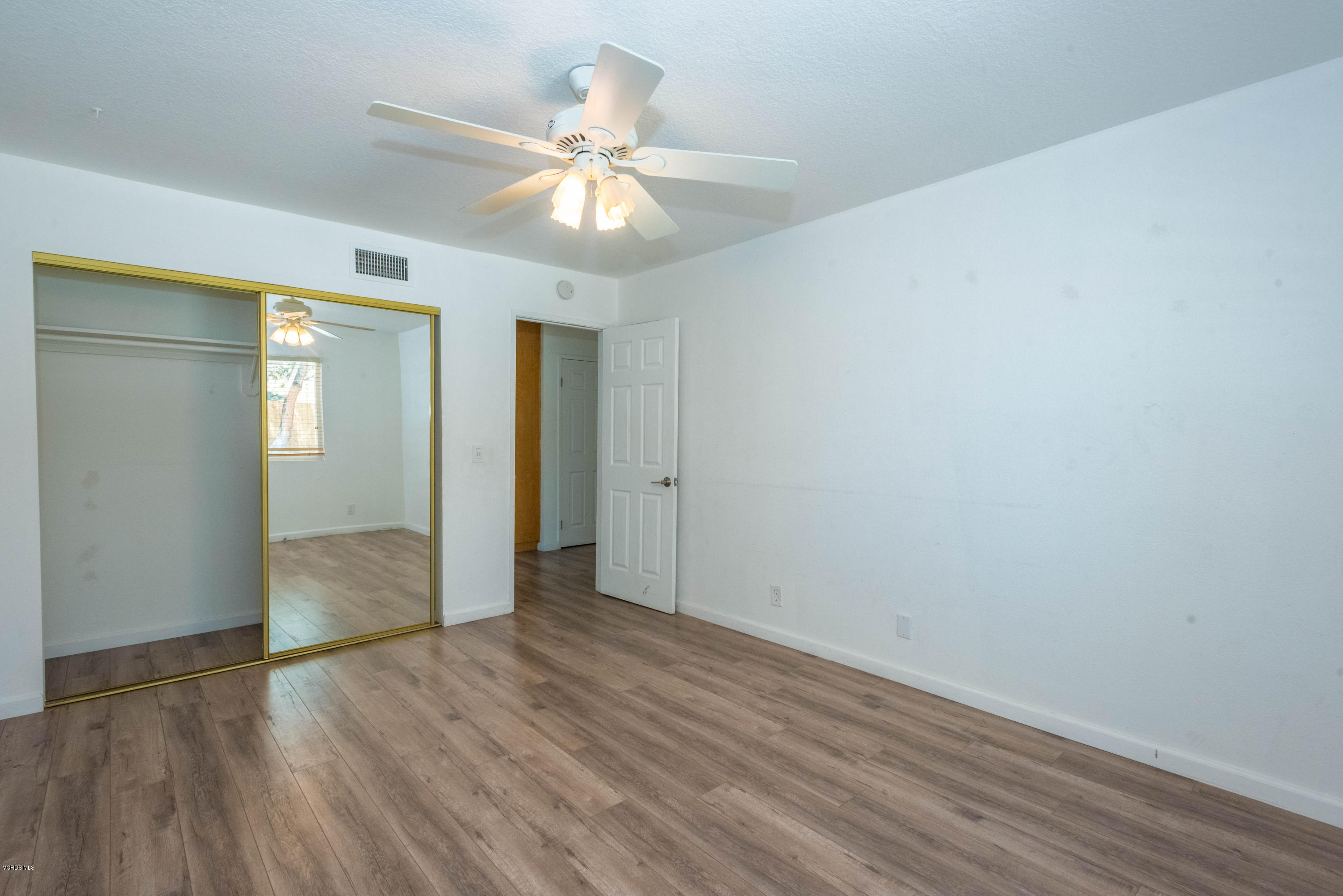 26026 Redbluff Drive Calabasas, CA 91302 - Photo 13 of 23 a view of an empty room with wooden floor