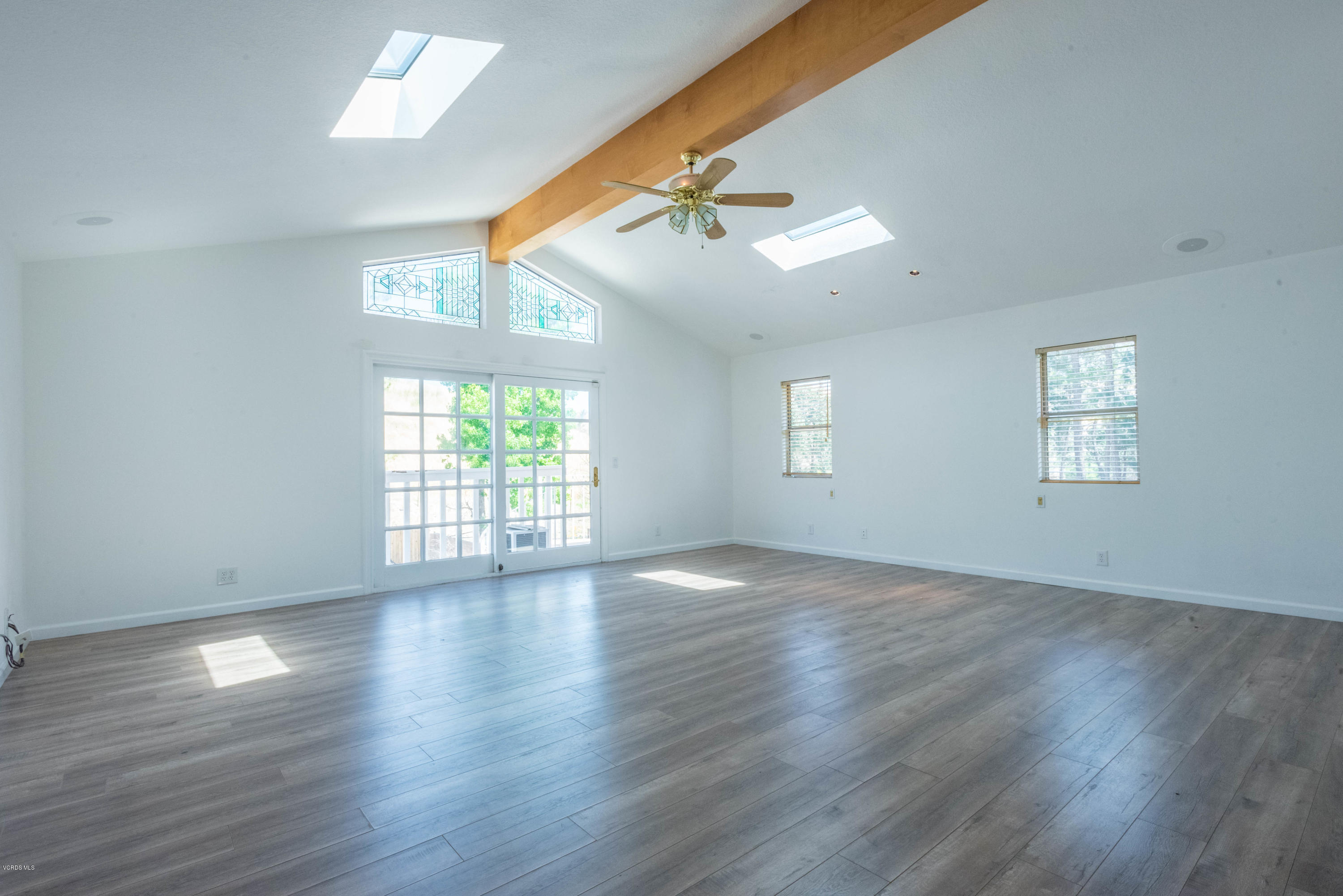 26026 Redbluff Drive Calabasas, CA 91302 - Photo 14 of 23 a view of an empty room with wooden floor and a window
