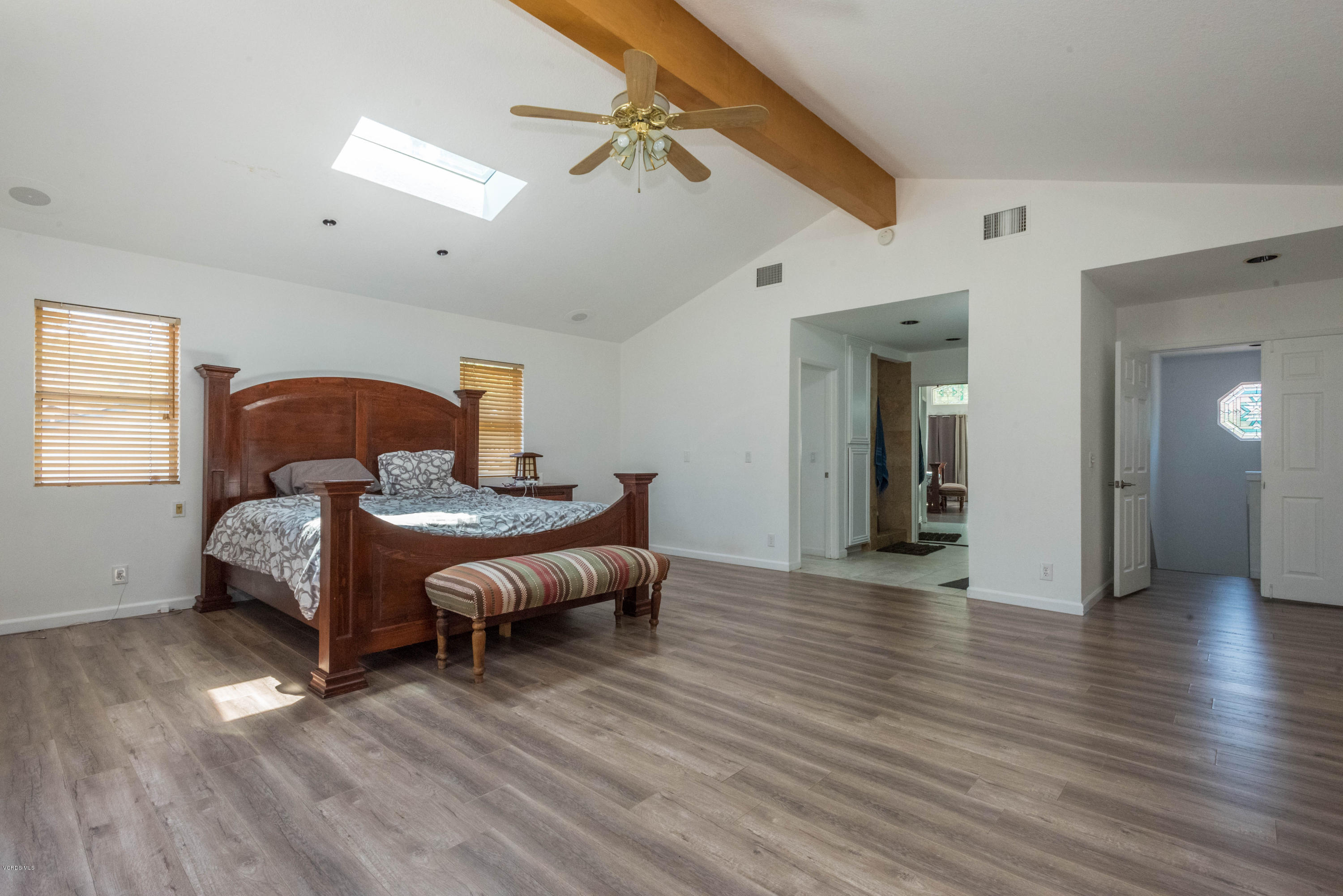 26026 Redbluff Drive Calabasas, CA 91302 - Photo 16 of 23 a bedroom with furniture and wooden floor