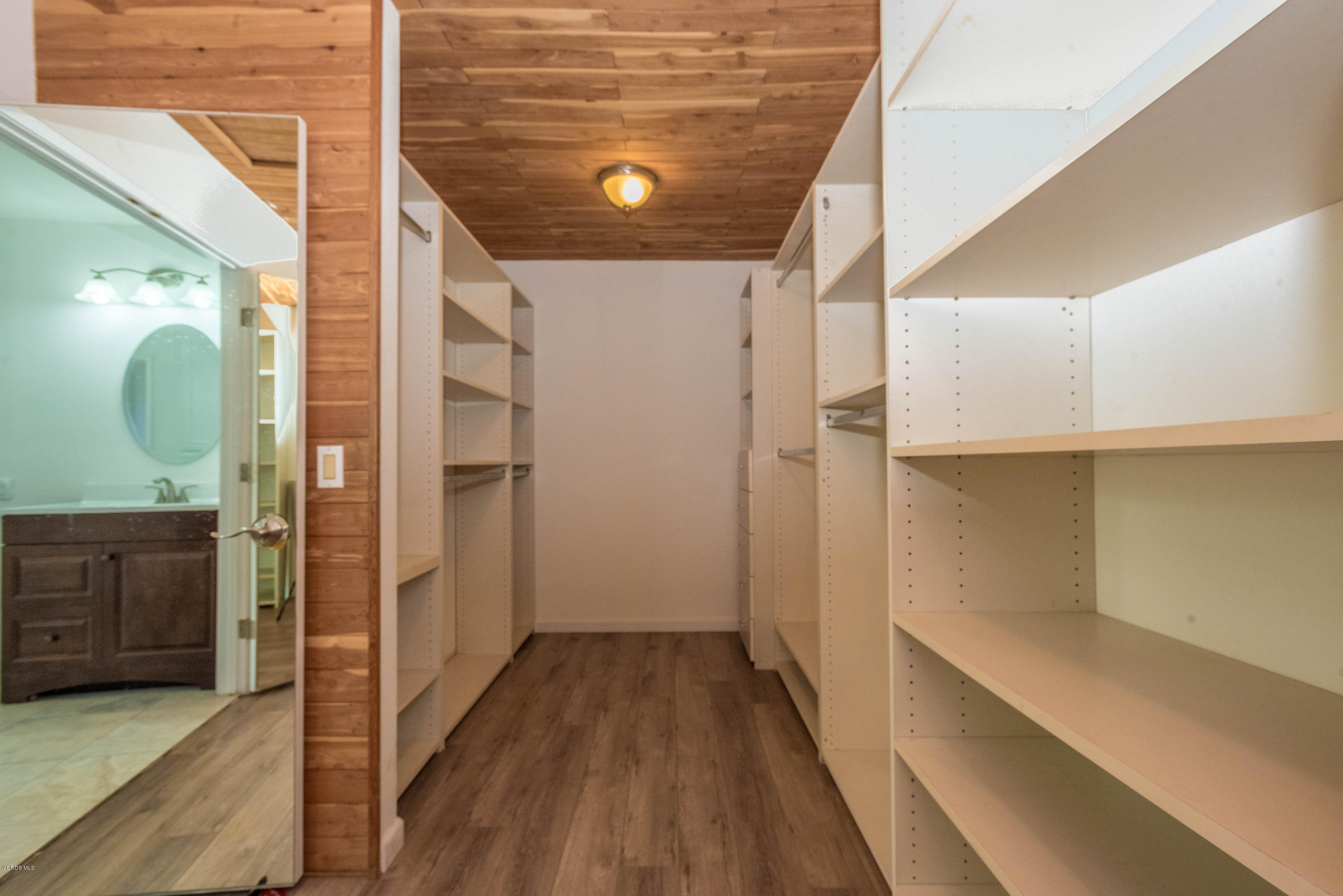 26026 Redbluff Drive Calabasas, CA 91302 - Photo 20 of 23 a view of a hallway with wooden floor