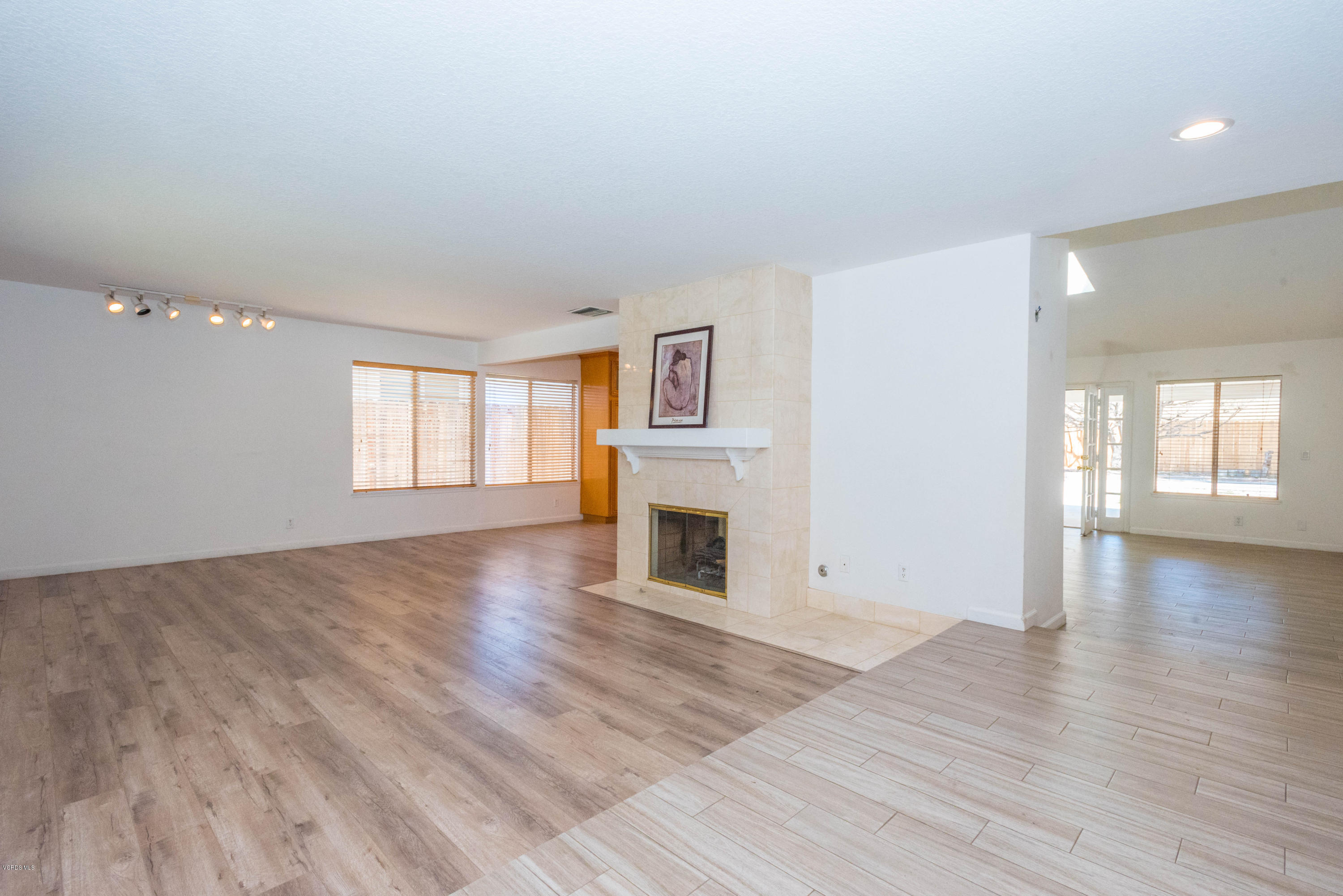26026 Redbluff Drive Calabasas, CA 91302 - Photo 3 of 23 a view of a livingroom with wooden floor and a fireplace