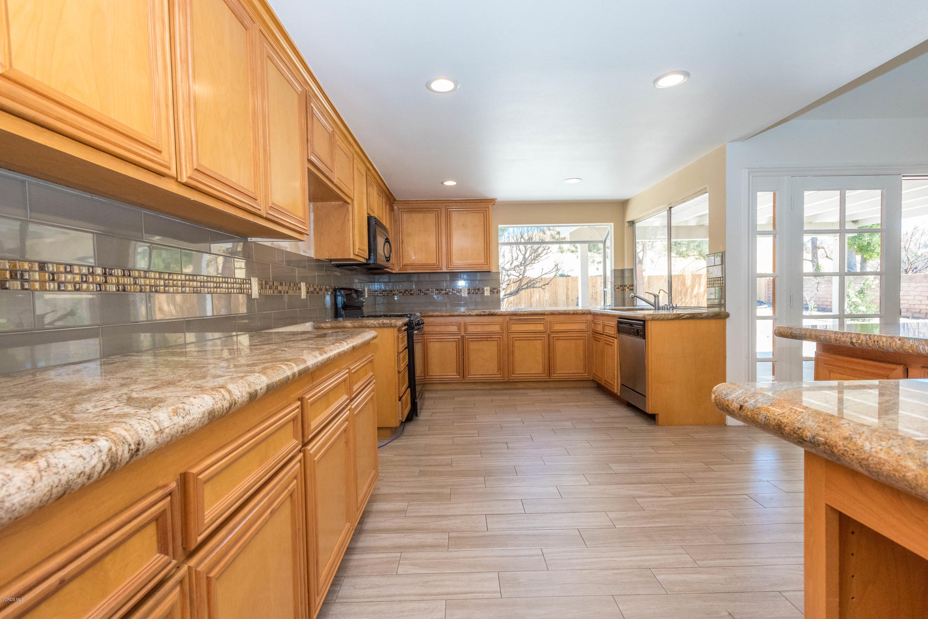 26026 Redbluff Drive Calabasas, CA 91302 - Photo 6 of 23 a large kitchen with stainless steel appliances granite countertop a granite counter tops and a window