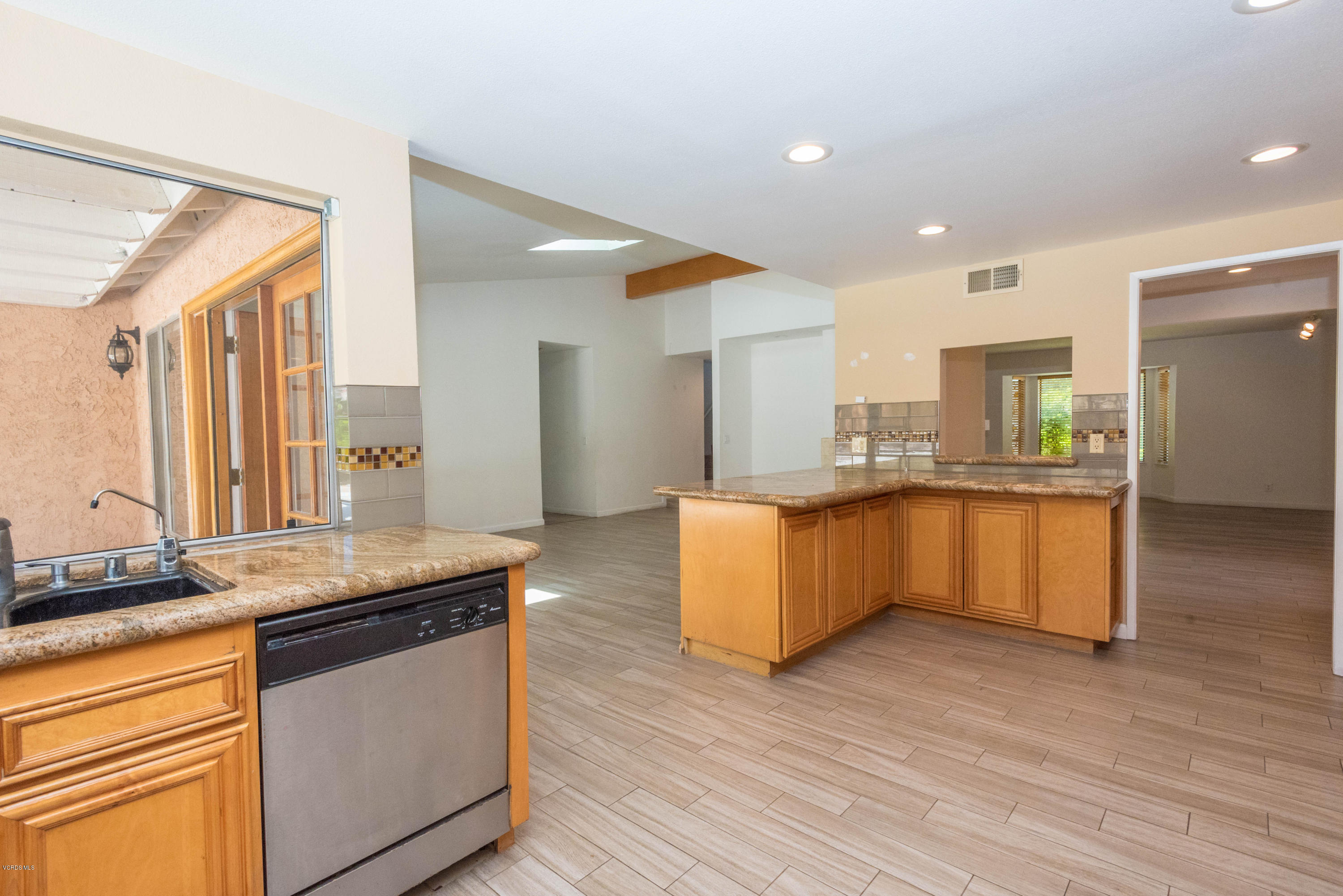26026 Redbluff Drive Calabasas, CA 91302 - Photo 9 of 23 a large kitchen with granite countertop a large counter top and sink