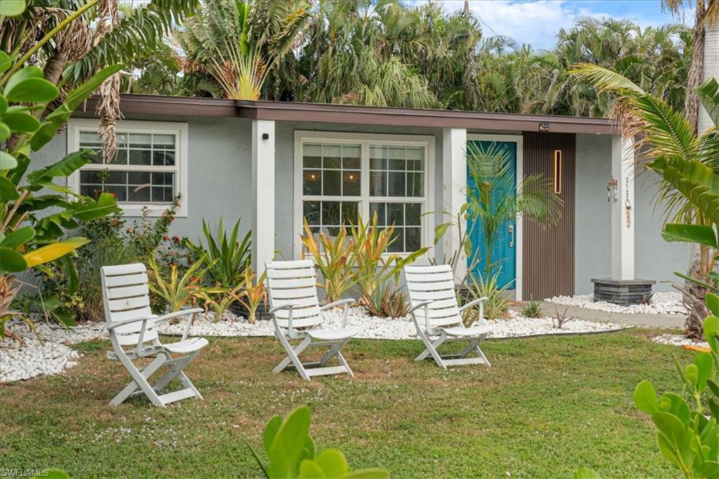 2123 Holiday Lane Naples, FL 34104 - Photo 2 of 32 View of front of home with a front lawn