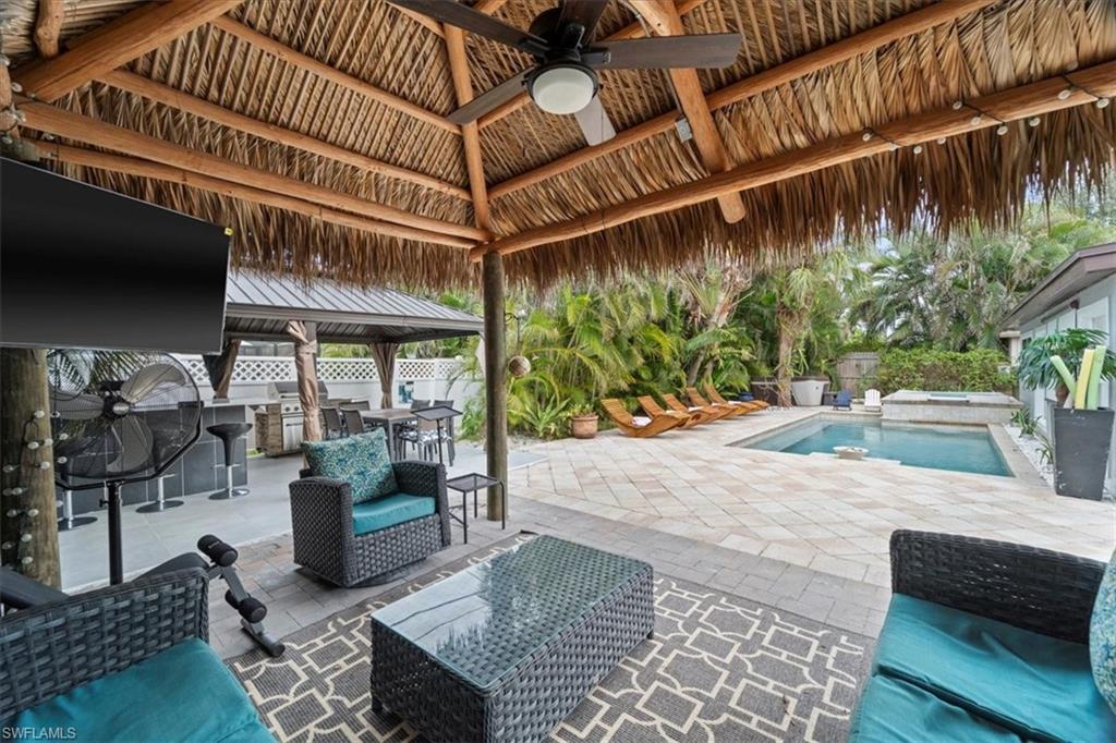 2123 Holiday Lane Naples, FL 34104 - Photo 25 of 32 View of patio / terrace featuring a gazebo, ceiling fan, an outdoor kitchen, and an outdoor hangout area