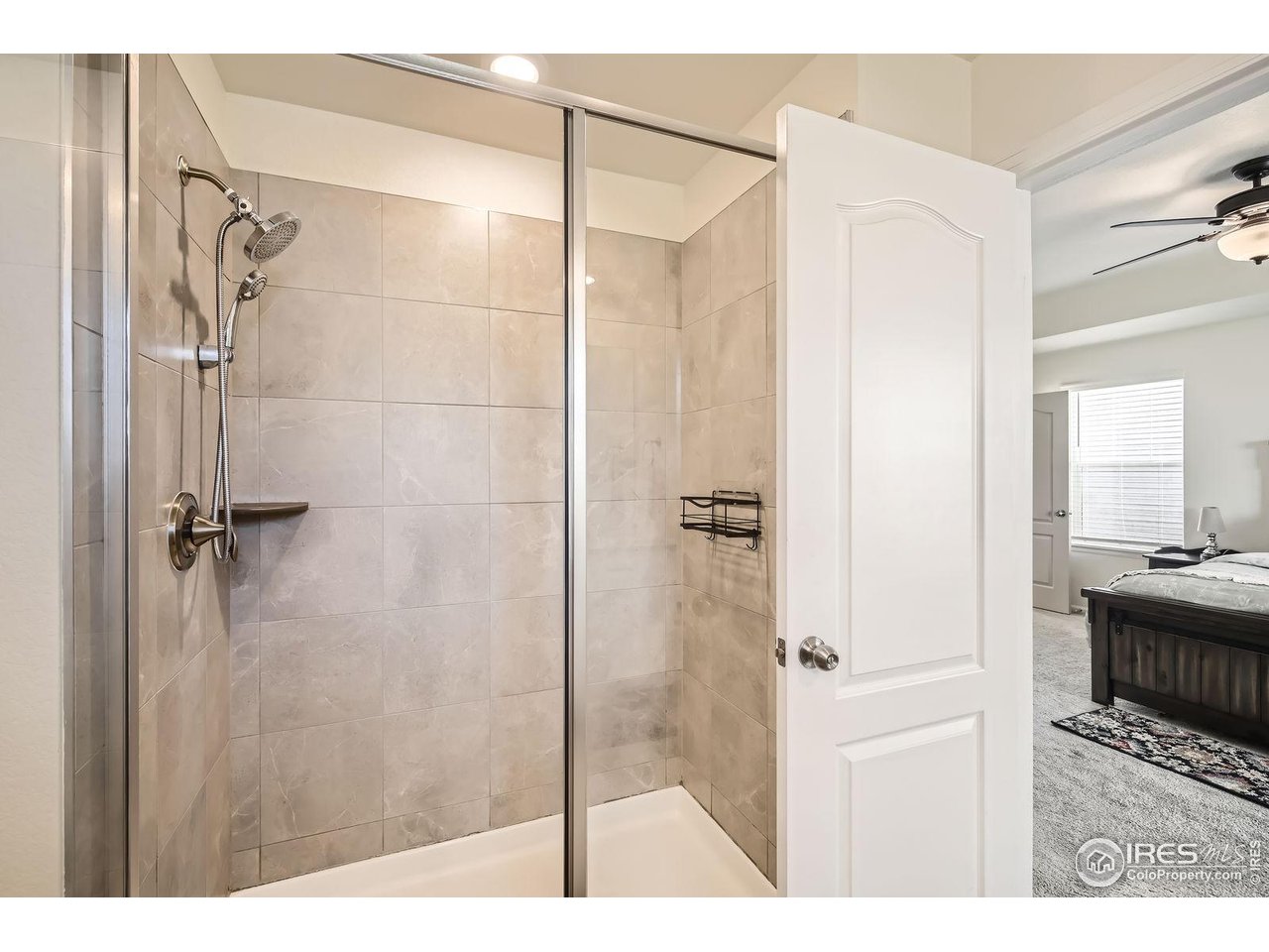12889 Clearview Street Firestone, CO 80504 - Photo 15 of 38 a bathroom with a shower and a sink