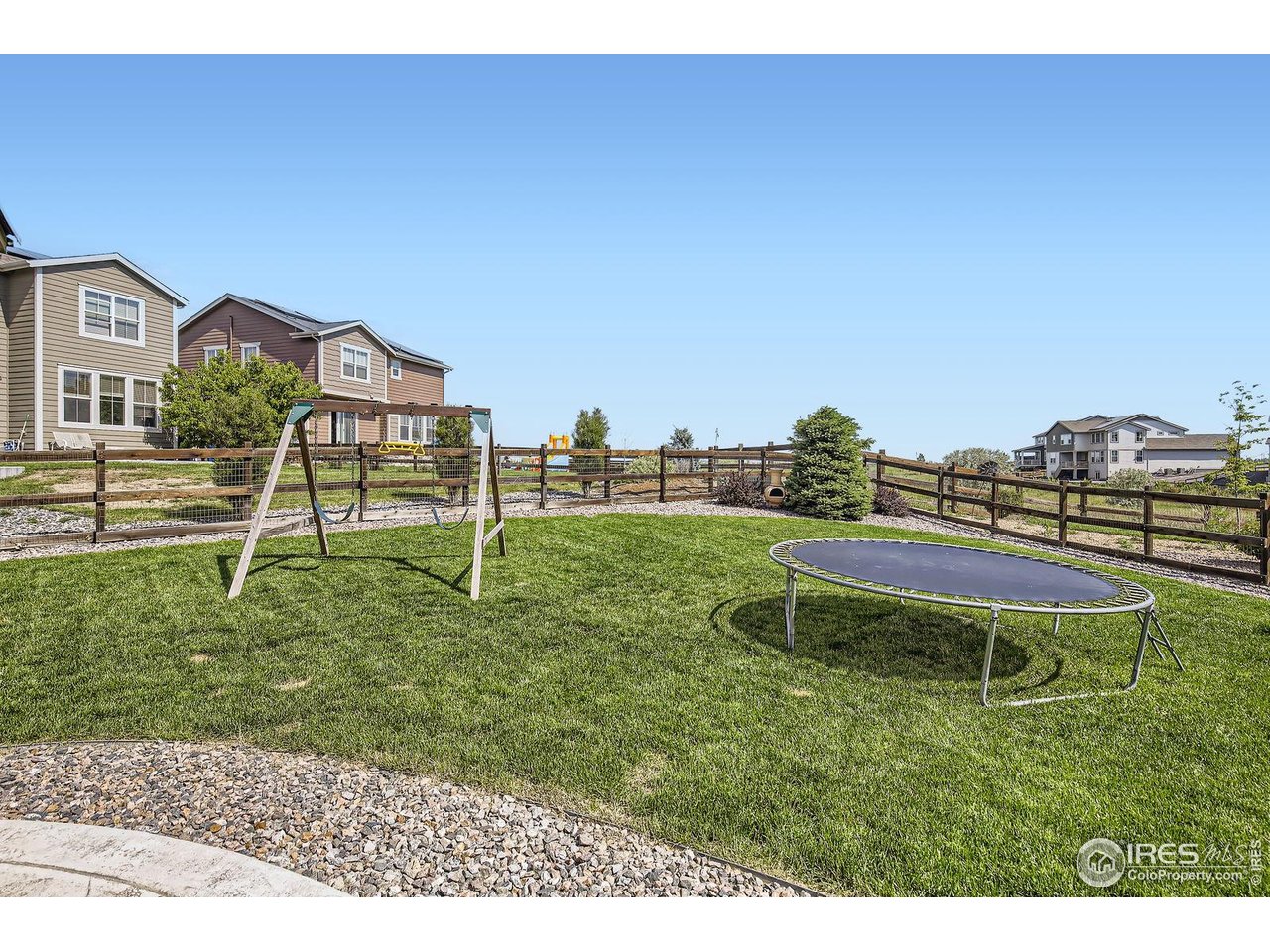 12889 Clearview Street Firestone, CO 80504 - Photo 23 of 38 a garden with wooden fence