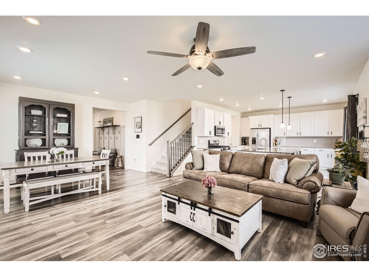 12889 Clearview Street Firestone, CO 80504 - Photo 3 of 38 a living room with furniture and wooden floor