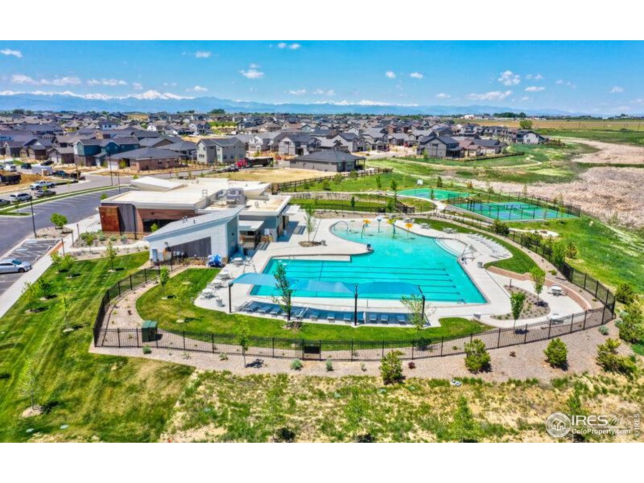 12889 Clearview Street Firestone, CO 80504 - Photo 32 of 38 an aerial view of a house with a garden and lake view