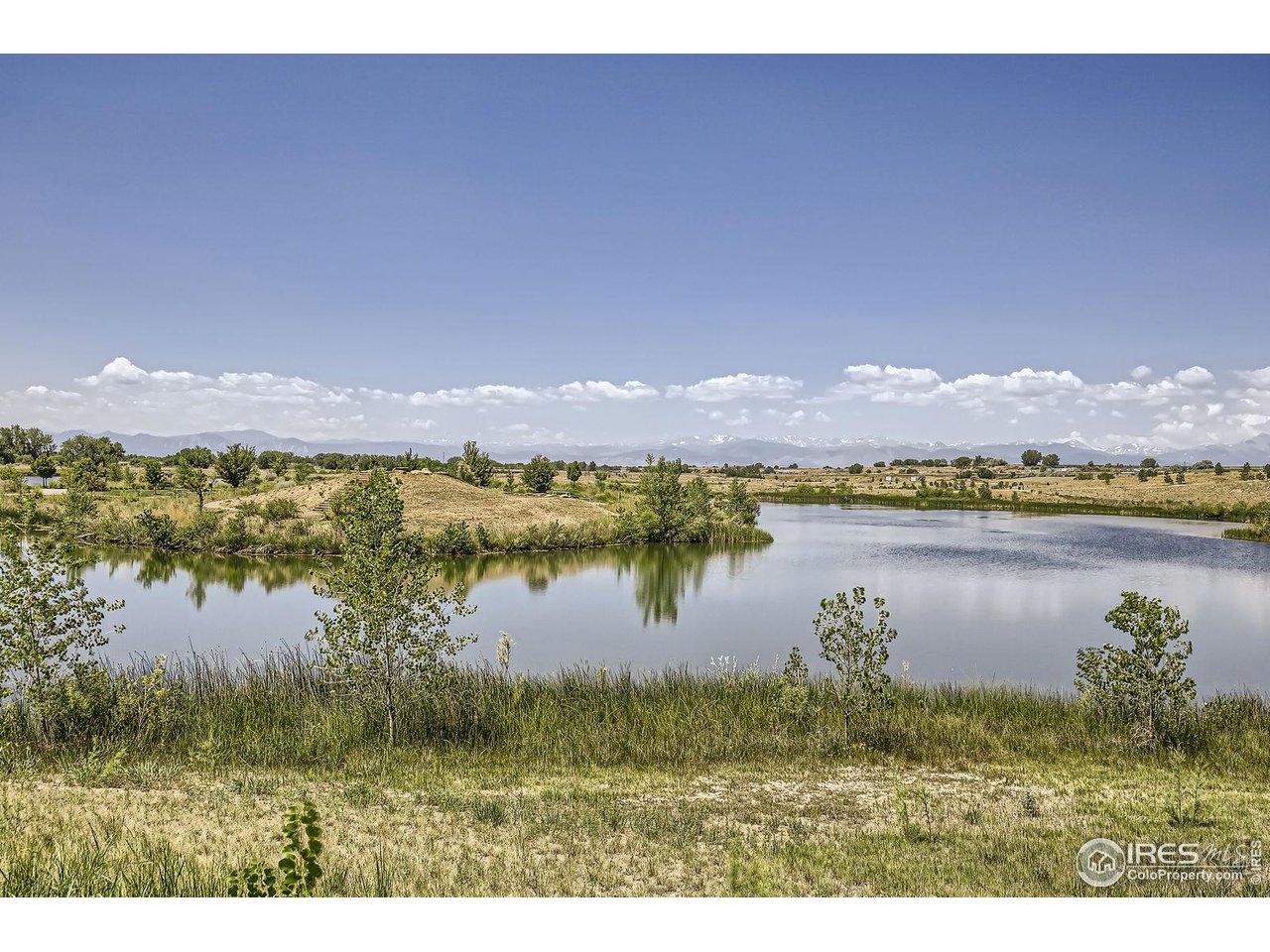 12889 Clearview Street Firestone, CO 80504 - Photo 34 of 38 a view of lake with mountain