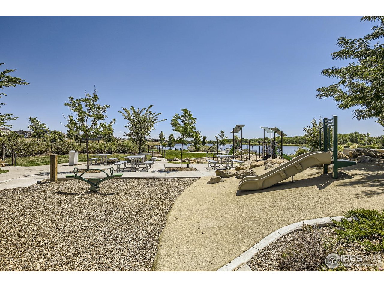 12889 Clearview Street Firestone, CO 80504 - Photo 38 of 38 a view of swimming pool with outdoor seating and trees in the background