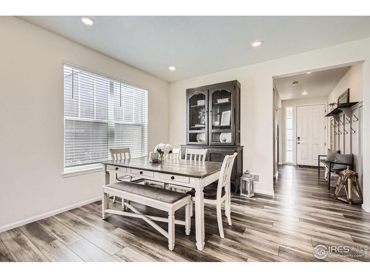 12889 Clearview Street Firestone, CO 80504 - Photo 7 of 38 a dining room with furniture and wooden floor
