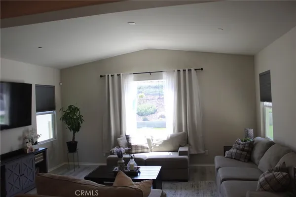 a living room with a couch and a window