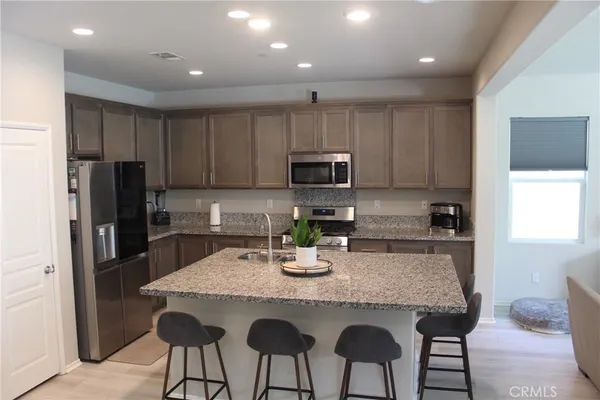 a kitchen with a stove and a microwave