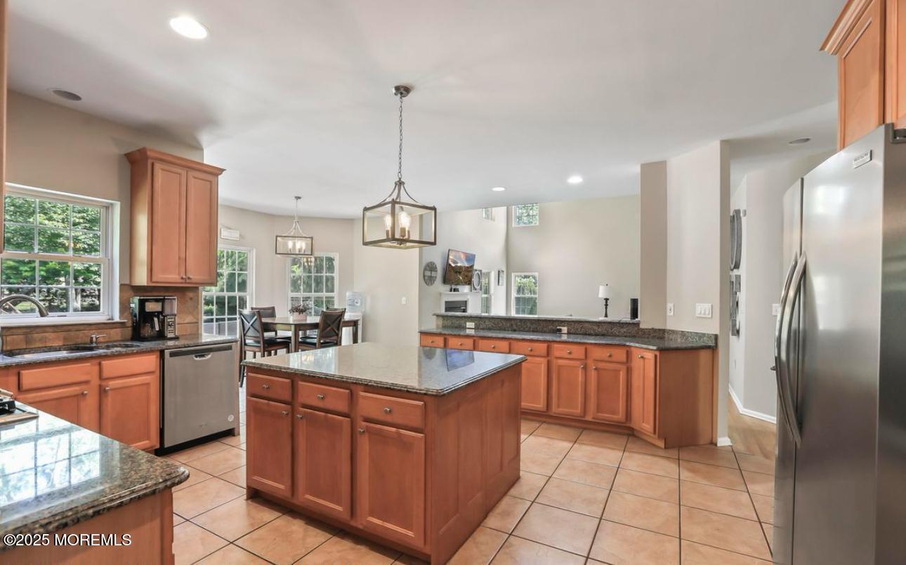 7 Round Hill Road Jackson, NJ 08527 - Photo 13 of 55 a large kitchen with stainless steel appliances granite countertop a sink counter space cabinets and a large window