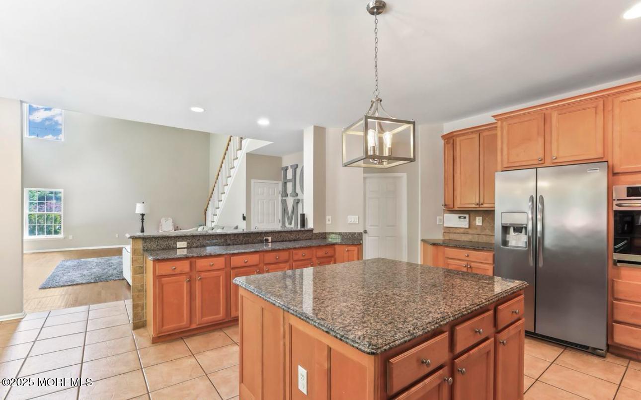 7 Round Hill Road Jackson, NJ 08527 - Photo 14 of 55 a kitchen with stainless steel appliances granite countertop a sink a refrigerator and center island