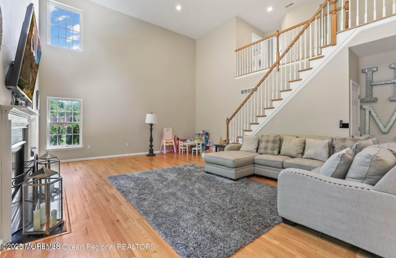 7 Round Hill Road Jackson, NJ 08527 - Photo 17 of 55 a living room with furniture and a flat screen tv