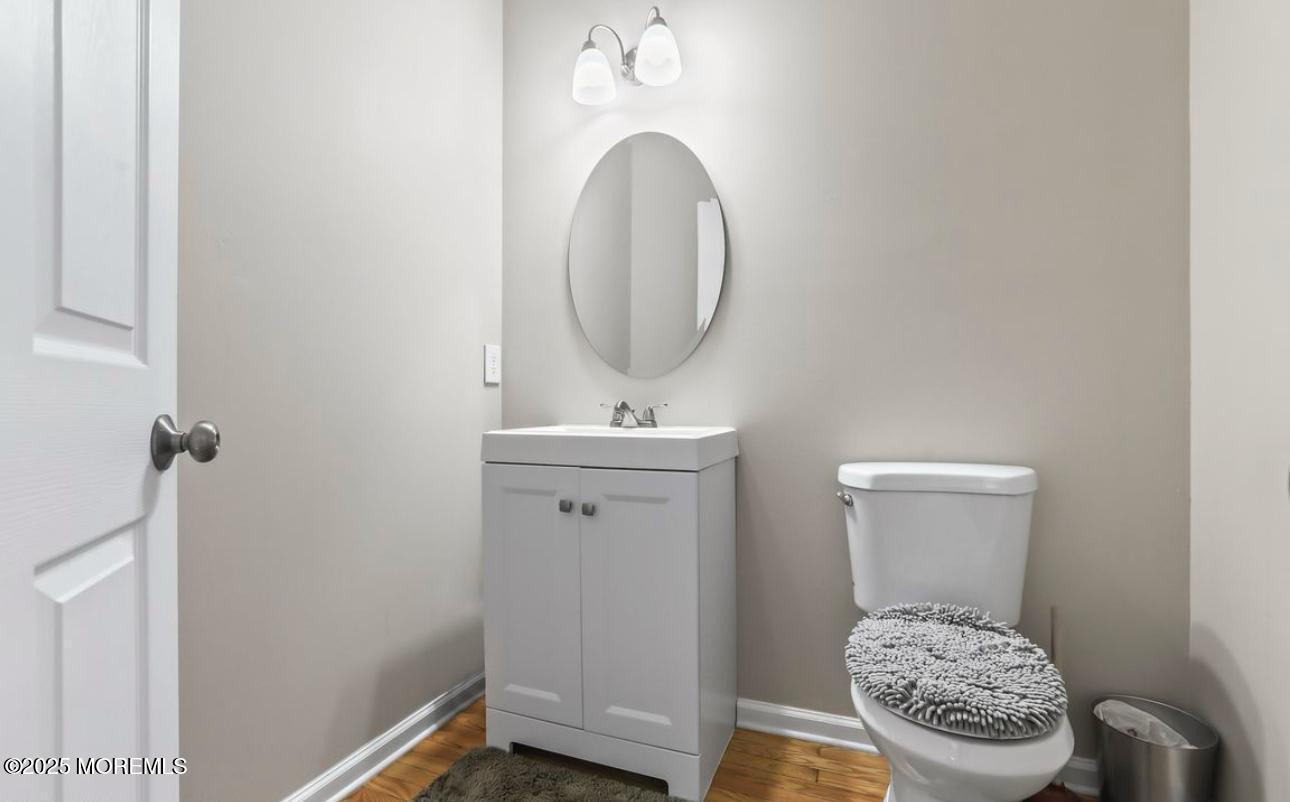 7 Round Hill Road Jackson, NJ 08527 - Photo 19 of 55 a bathroom with a toilet a sink and mirror