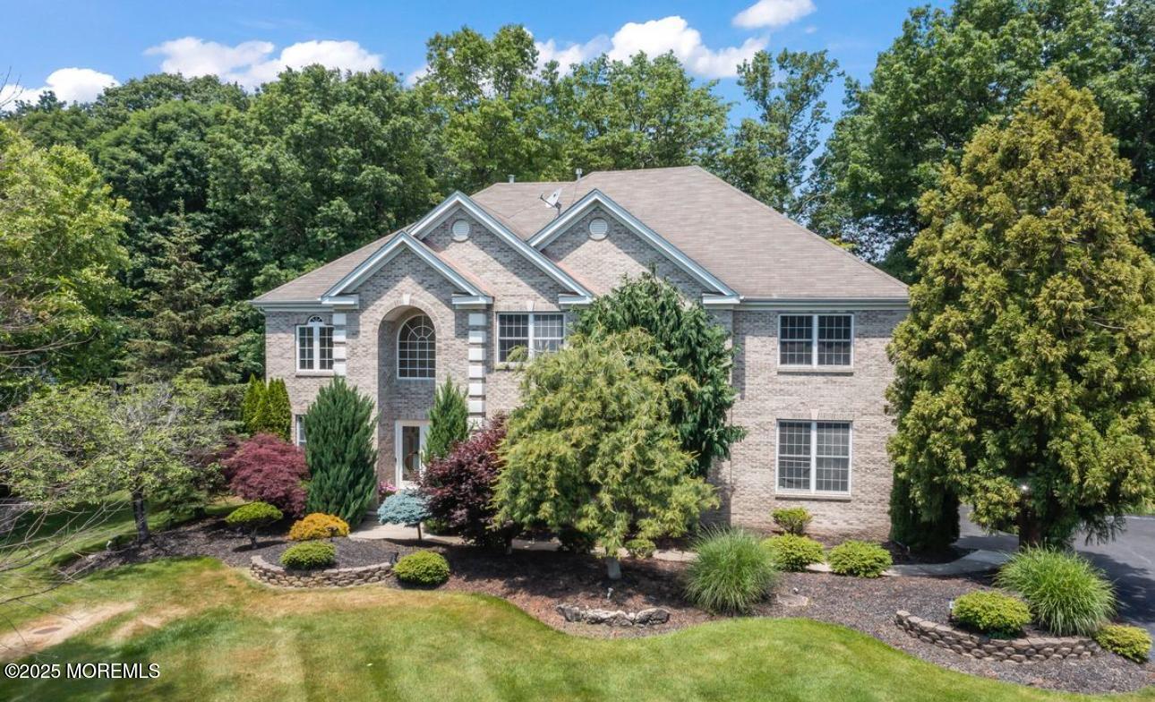 7 Round Hill Road Jackson, NJ 08527 - Photo 2 of 55 a house view with a garden